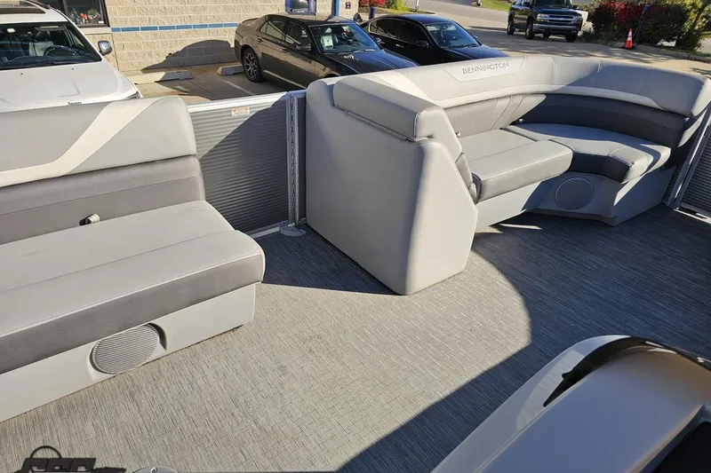 Slide: The Image of 2022 Bennington SX 21 Fishing boat interior with gray seating and spacious layout. - 55