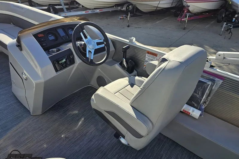 Slide: The Image of 2022 Bennington SX 21 Fishing boat interior with steering wheel and captain's chair. - 58