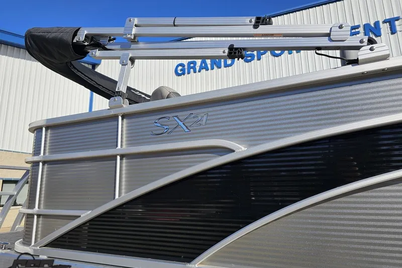 Slide: The Image of 2022 Bennington SX 21 Fishing boat side view with sleek design and branding. - 6