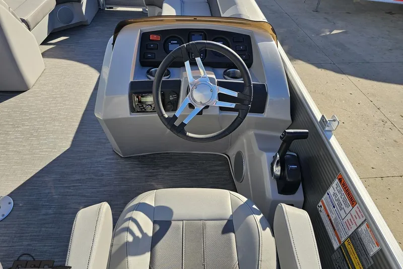 Slide: The Image of 2022 Bennington SX 21 Fishing boat interior with steering wheel and controls. - 60
