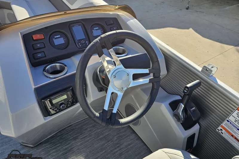 Slide: The Image of 2022 Bennington SX 21 Fishing boat dashboard with steering wheel and control panel. - 62