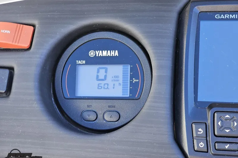 Slide: The Image of Yamaha tachometer and Garmin display on 2022 Bennington SX 21 Fishing boat dashboard. - 64