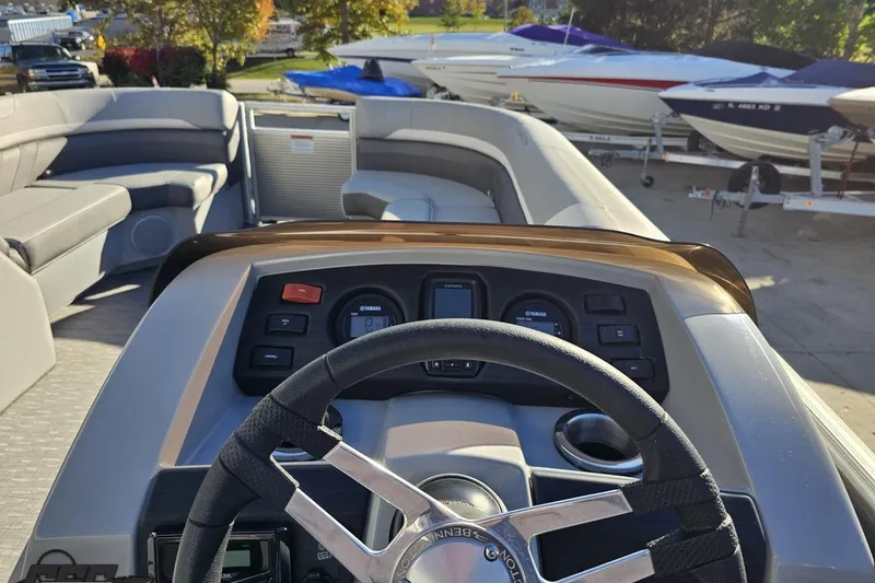 Slide: The Image of 2022 Bennington SX 21 Fishing boat dashboard with steering wheel and seating area. - 67
