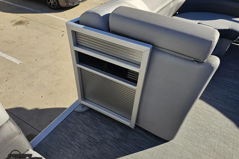 Slide: The Image of 2022 Bennington SX 21 Fishing boat interior with gray seating and storage compartment. - 72