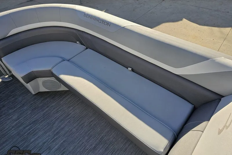 Slide: The Image of 2022 Bennington SX 21 Fishing boat interior with gray seating and flooring. - 80