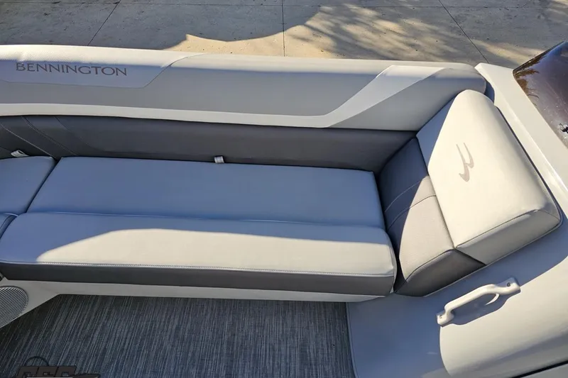 Slide: The Image of 2022 Bennington SX 21 Fishing boat interior with gray cushioned seating. - 81