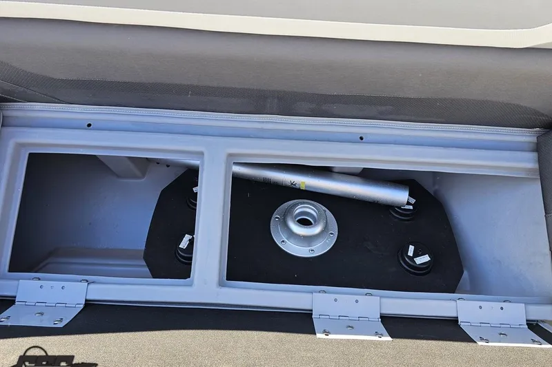 Slide: The Image of 2022 Bennington SX 21 Fishing boat storage compartment with metal fittings and hinges. - 82