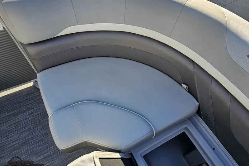 Slide: The Image of 2022 Bennington SX 21 Fishing boat with gray cushioned seating and storage compartment. - 83