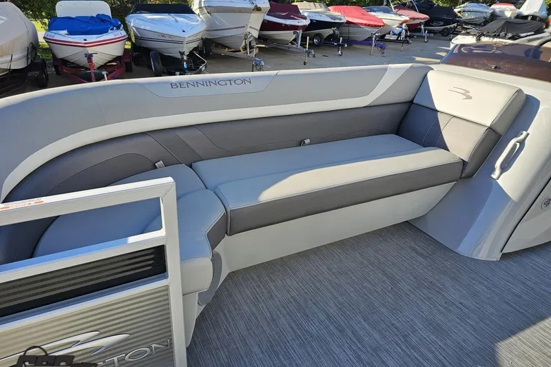 Slide: The Image of 2022 Bennington SX 21 Fishing boat interior with gray seating and sleek design. - 90