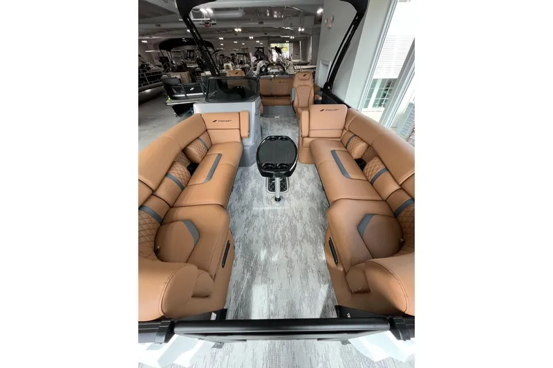Slide: The Image of Luxurious interior of 2026 Starcraft RX 25 DL DC boat with tan leather seating. - 4