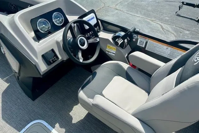 Slide: The Image of 2026 Barletta A22QC boat cockpit with modern steering and controls. - 4