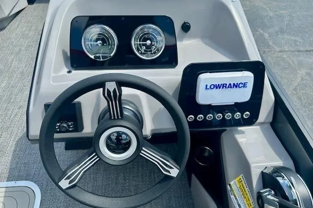 Slide: The Image of Steering console of 2026 Barletta A22QC boat with Lowrance display and gauges. - 5