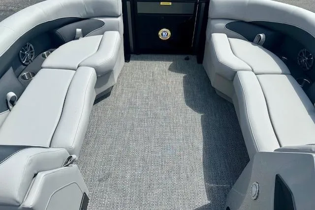 Slide: The Image of 2026 Barletta A22QC boat interior with gray seating and carpet flooring. - 8