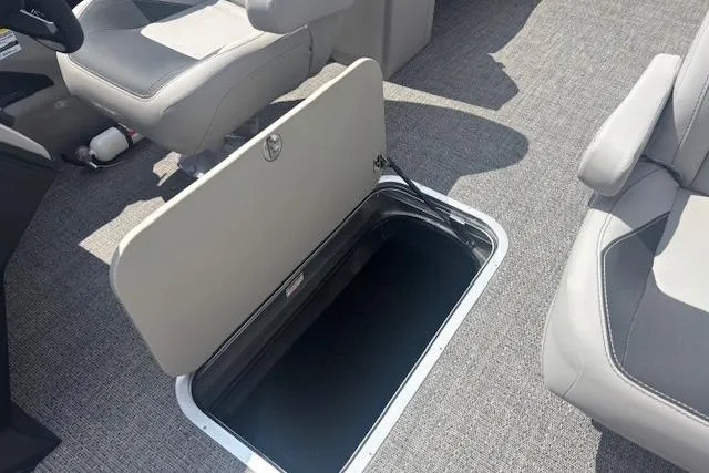 Slide: The Image of Interior view of 2026 Barletta A24QC boat with open storage compartment. - 11