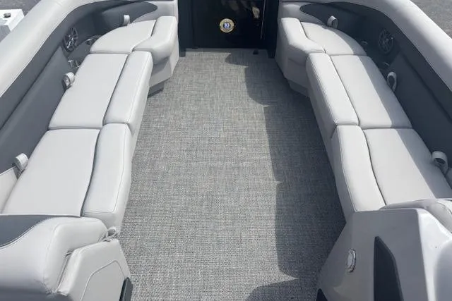 Slide: The Image of 2026 Barletta A24QC boat interior with gray seating and carpet flooring. - 6