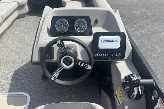 Slide: The Image of Steering console of 2026 Barletta A24QC boat with Lowrance display and gauges. - 8