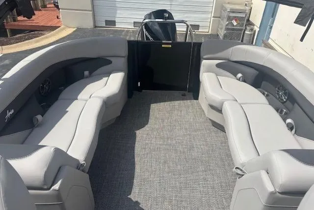 Slide: The Image of 2026 Barletta A24QC boat interior with gray seating and carpeted floor. - 9