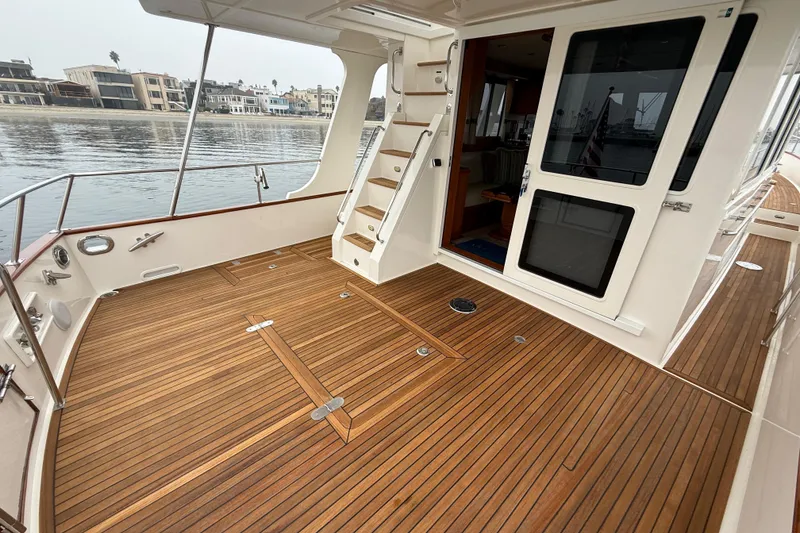 Slide: The Image of 2009 Grand Banks 47 Heritage EU yacht with elegant teak deck and spacious outdoor area. - 10