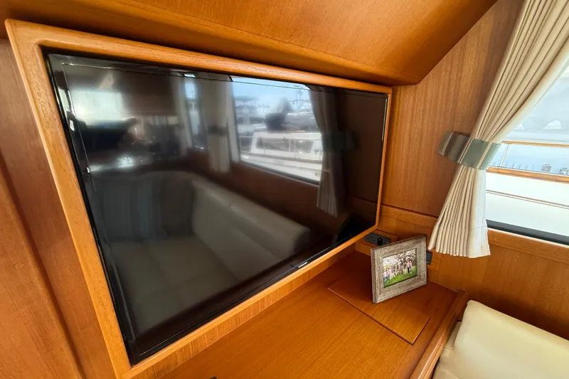 Slide: The Image of Interior of 2009 Grand Banks 47 Heritage EU yacht with TV and framed photo. - 18