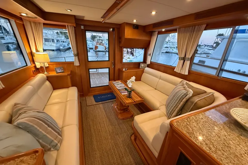 Slide: The Image of Luxurious interior of 2009 Grand Banks 47 Heritage EU yacht with elegant seating and marina view. - 21