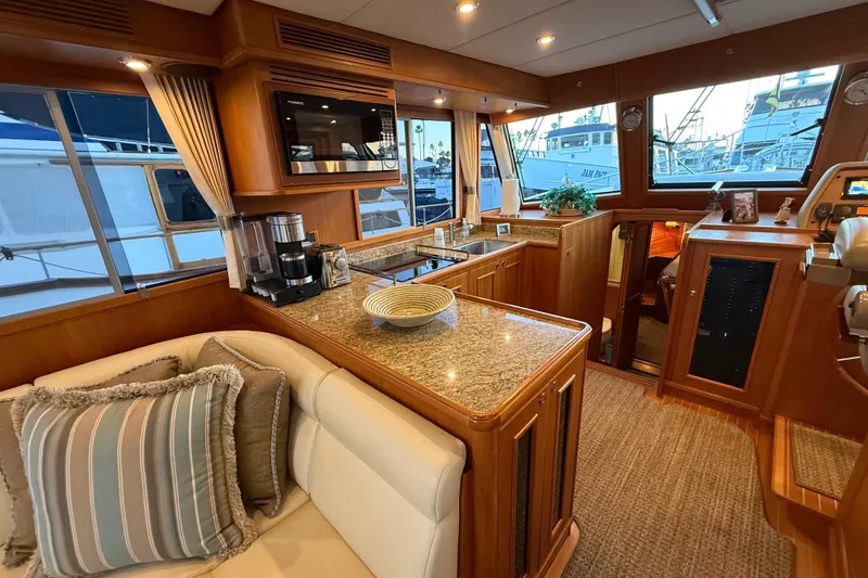 Slide: The Image of Luxurious 2009 Grand Banks 47 Heritage EU yacht interior with elegant kitchen and seating area. - 24
