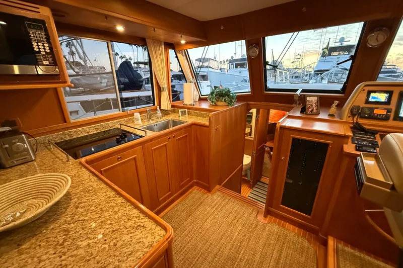 Slide: The Image of Luxurious 2009 Grand Banks 47 Heritage EU yacht interior with elegant wood finishes and modern amenities. - 25