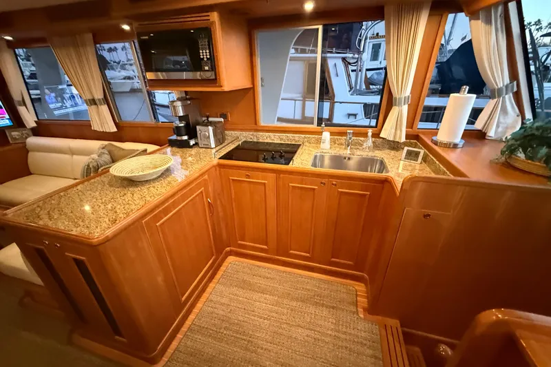 Slide: The Image of Luxurious 2009 Grand Banks 47 Heritage EU yacht interior with elegant kitchen and granite countertops. - 27