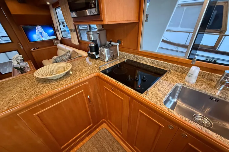Slide: The Image of Luxurious kitchen interior of 2009 Grand Banks 47 Heritage EU yacht with granite countertops. - 28