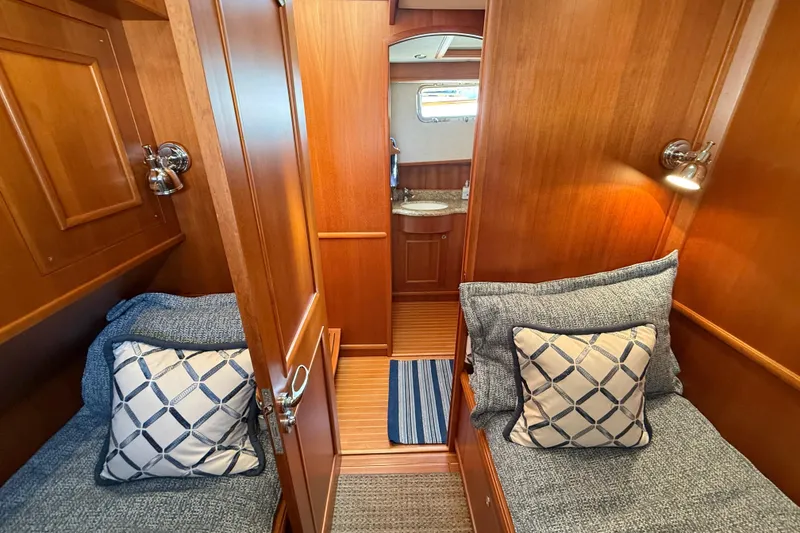 Slide: The Image of Luxurious 2009 Grand Banks 47 Heritage EU cabin with twin beds and elegant wood finish. - 44