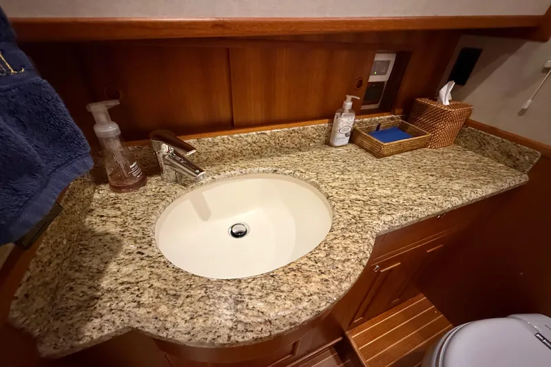 Slide: The Image of Luxurious bathroom sink with granite countertop on 2009 Grand Banks 47 Heritage EU yacht. - 48