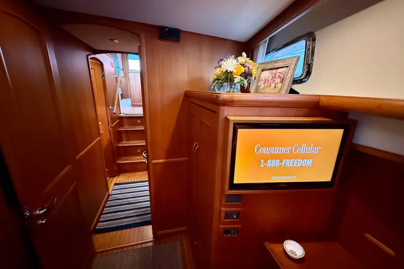 Slide: The Image of Luxurious interior of 2009 Grand Banks 47 Heritage EU yacht with wood paneling and TV. - 56
