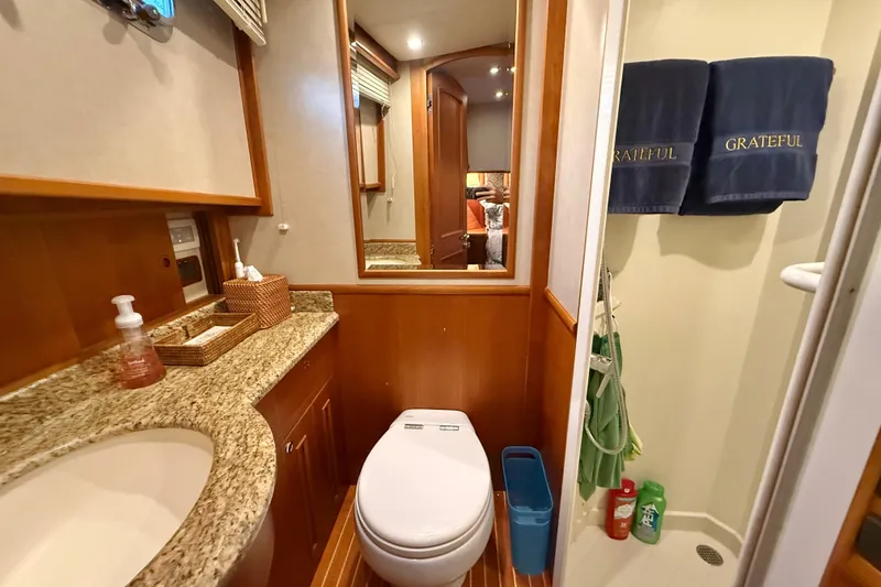 Slide: The Image of Luxurious bathroom in 2009 Grand Banks 47 Heritage EU yacht with granite countertop and shower. - 59