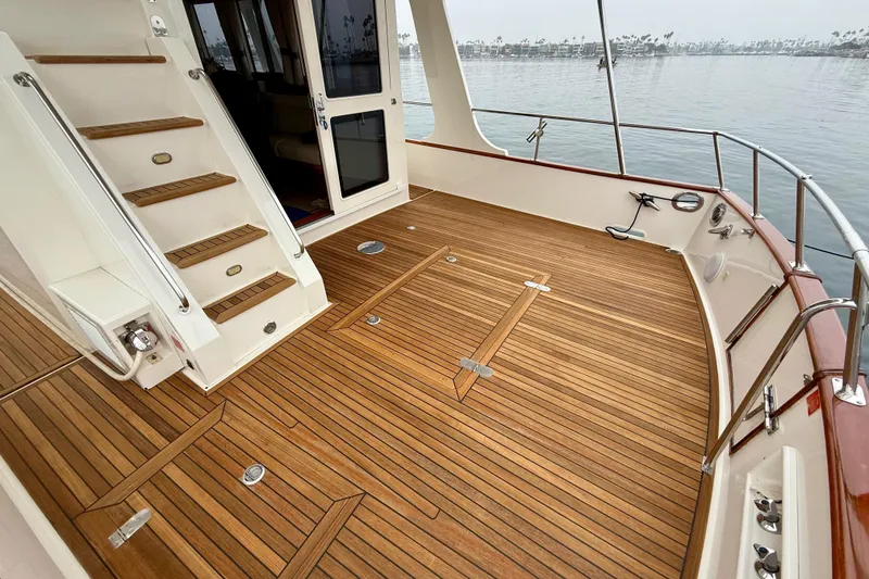 Slide: The Image of 2009 Grand Banks 47 Heritage EU yacht with teak deck and elegant staircase. - 62