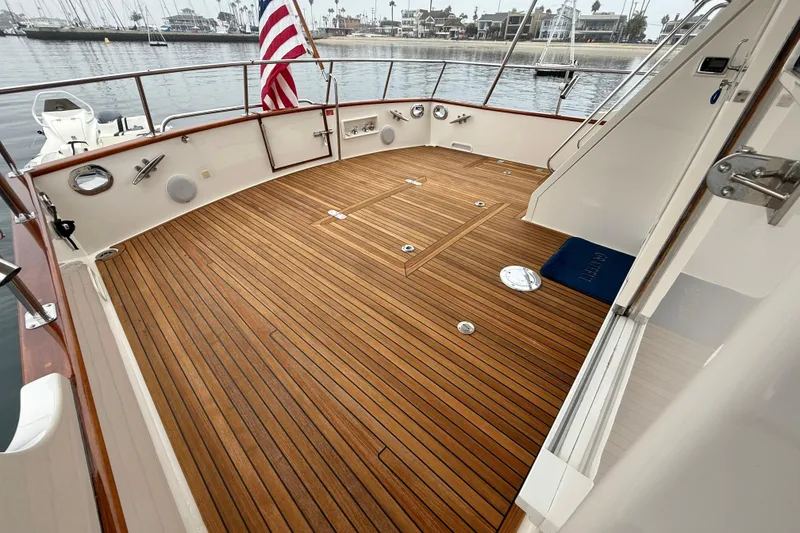 Slide: The Image of Teak deck of 2009 Grand Banks 47 Heritage EU yacht with American flag. - 64