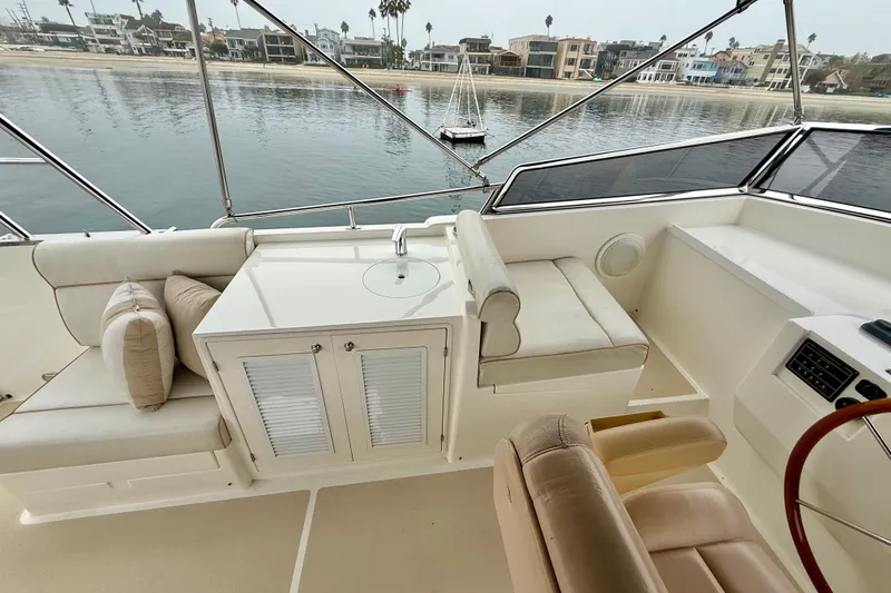 Slide: The Image of 2009 Grand Banks 47 Heritage EU yacht interior with seating and waterfront view. - 70