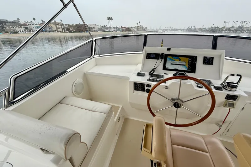 Slide: The Image of Helm of 2009 Grand Banks 47 Heritage EU yacht with navigation equipment and steering wheel. - 72