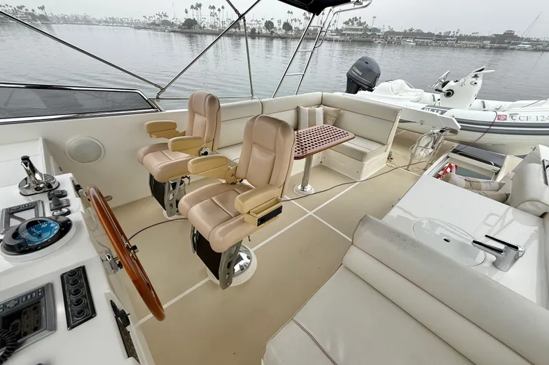 Slide: The Image of Flybridge of 2009 Grand Banks 47 Heritage EU with helm chairs and seating area. - 77