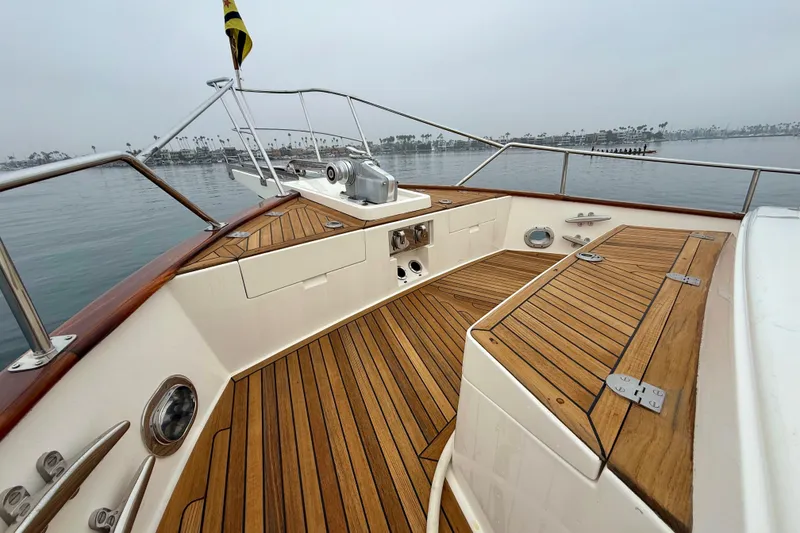 Slide: The Image of 2009 Grand Banks 47 Heritage EU yacht deck with teak flooring and stainless steel fittings. - 80