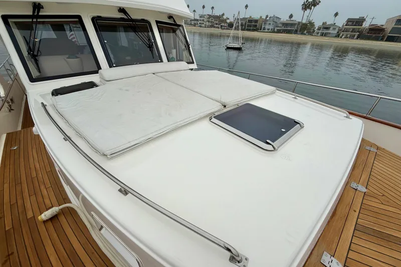 Slide: The Image of 2009 Grand Banks 47 Heritage EU yacht with spacious deck and waterfront view. - 84