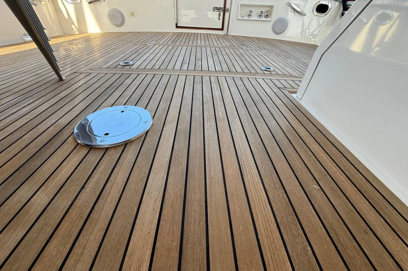 Slide: The Image of Teak deck of 2009 Grand Banks 47 Heritage EU yacht, showcasing elegant wood finish. - 86