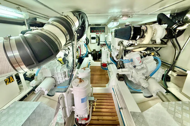 Slide: The Image of Engine room of 2009 Grand Banks 47 Heritage EU yacht, showcasing dual engines and mechanical systems. - 89