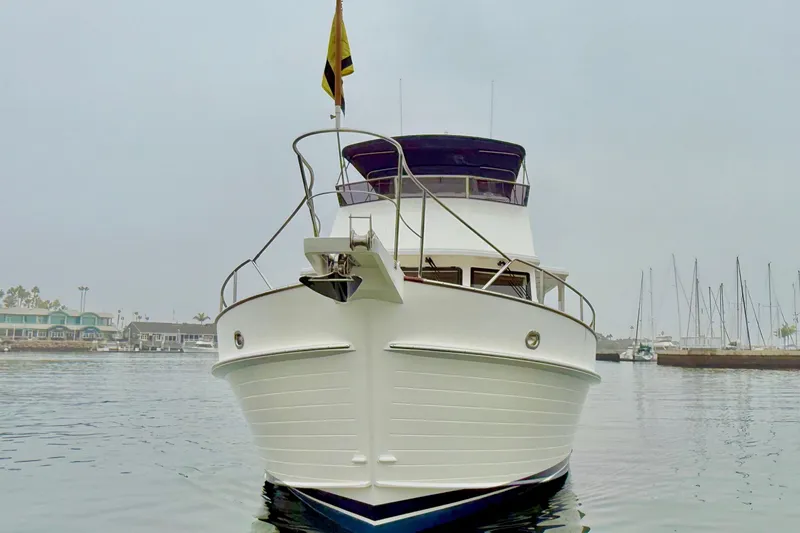 Slide: The Image of 2009 Grand Banks 47 Heritage EU yacht docked in a marina, front view. - 9