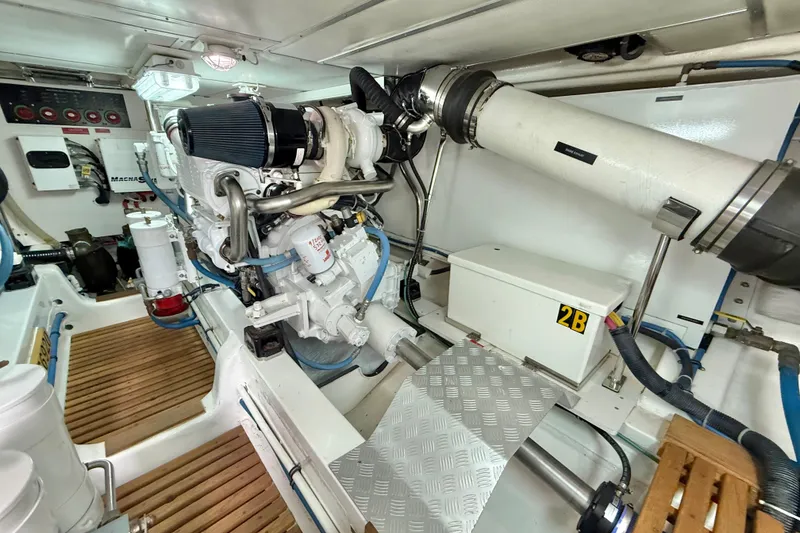 Slide: The Image of Engine room of 2009 Grand Banks 47 Heritage EU yacht, showcasing mechanical components. - 90