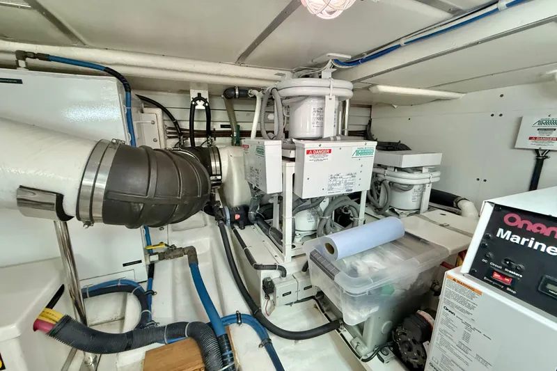 Slide: The Image of Engine room of 2009 Grand Banks 47 Heritage EU with Onan marine generator and air conditioning units. - 91