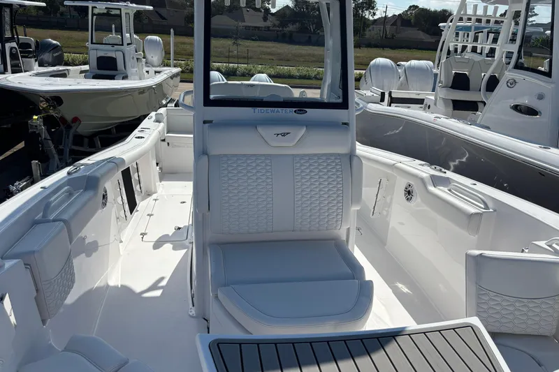 Slide: The Image of 2026 Tidewater 272 LXF boat interior with white seating and sleek design. - 12