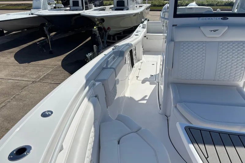 Slide: The Image of 2026 Tidewater 272 LXF boat interior with white seating and sleek design. - 14