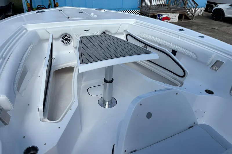 Slide: The Image of 2026 Tidewater 272 LXF boat interior with seating and table, showcasing modern design. - 16