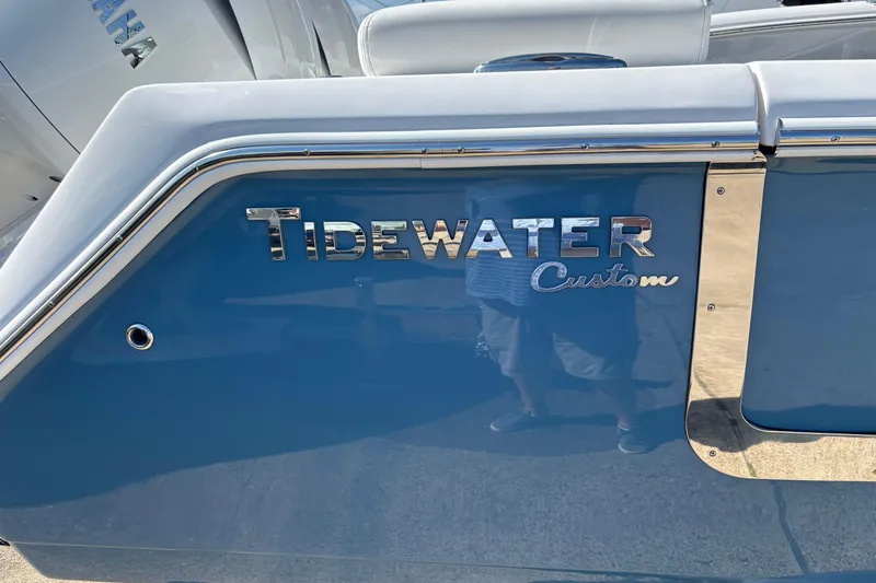 Slide: The Image of 2026 Tidewater 272 LXF boat with custom blue exterior and chrome detailing. - 3