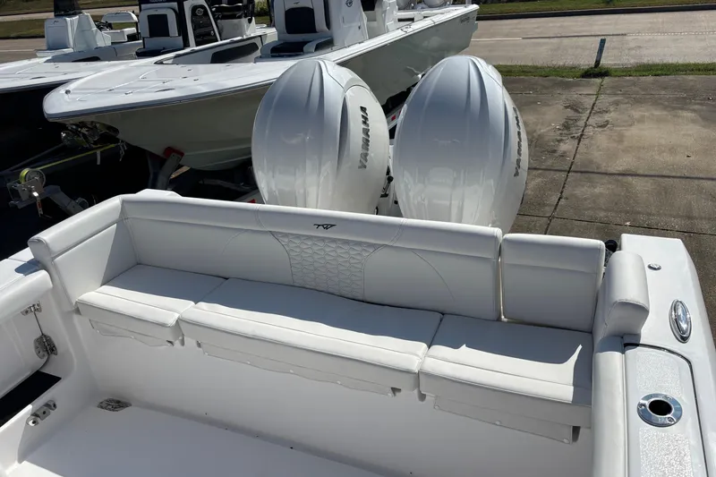 Slide: The Image of 2026 Tidewater 272 LXF boat with dual Yamaha engines and white seating. - 6
