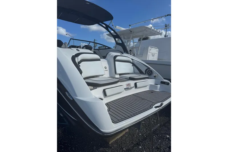 Slide: The Image of 2019 Yamaha Boats 242 Limited S, rear view with seating and swim platform. - 4